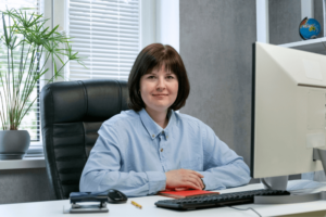 Lady sitting in front of a computer - a director
