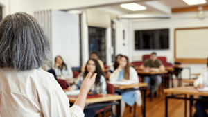 Back of a teacher in a classroom