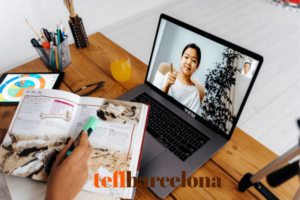 Online lesson happening with an asian girl, computer and book