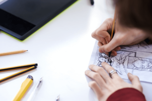 Hands of a students drawing
