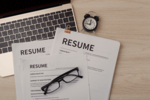 photo of 2 resumes on a desk