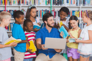 Teacher surrounded by kids