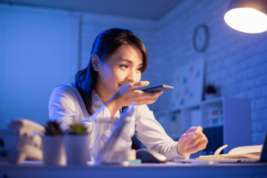Student using her phone to learn English