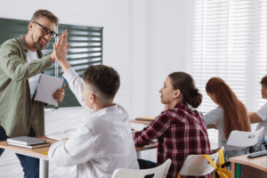 High-five with a student